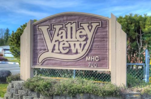 Valley view hmc sign in front of a fence.